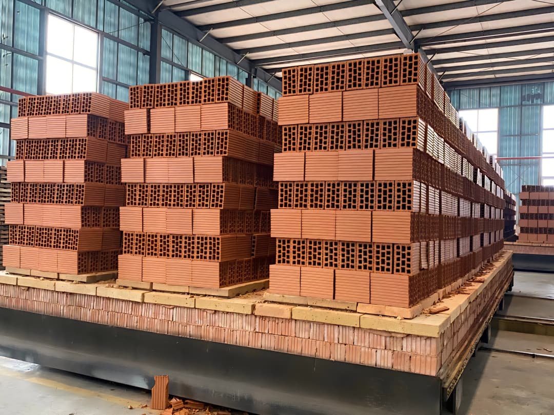 Drying cart with green bricks inside tunnel dryer for moisture removal